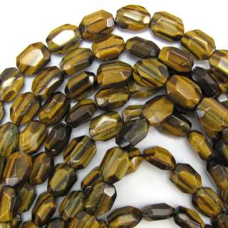Faceted tiger eye flat oval beads. This strand is 16 long, about 