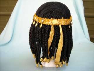 The wig is made out of a yarn type of material and a gold color trim.