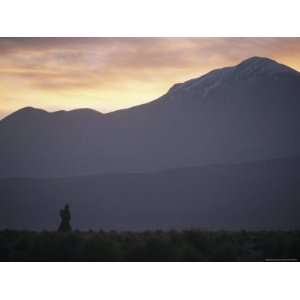  An Aymara Woman Silhouetted against the Andes in the Atacama Region 