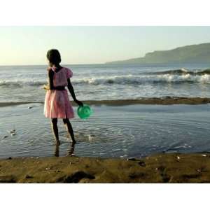 Girl Walks on the Beach in Jacmel, Haiti, in This February 5, 2001 