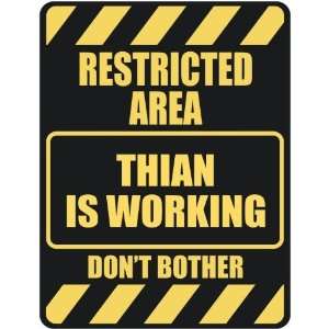   RESTRICTED AREA THIAN IS WORKING  PARKING SIGN