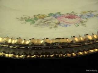  each plate with 6 swags of flowers around the edge and on the verge