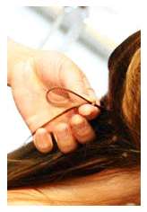 hold sectioned hair between 2 fingers 2 place hair extension loop on 