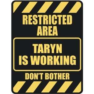  RESTRICTED AREA TARYN IS WORKING  PARKING SIGN