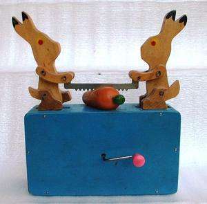   Antique Russian mechanical musical toy Two rabbit sawing carrot  