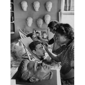 Souvenir Plaster Heads of James Dean Being Painted by Women in a 