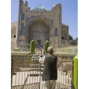 Man Opening Doors to Collection of Graves in Front of Shrine of Khwaja 