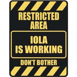   RESTRICTED AREA IOLA IS WORKING  PARKING SIGN