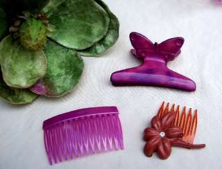   THREE SIDE COMBS, A MATCHED PAIR OF BARRETTES AND A MEDIUM HAIR CLAMP