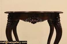 Carved of mahogany about 1860, this lovely parlor or lamp table was 