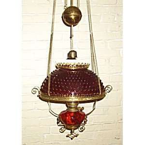 ruby red hanging oil lamp   antique brass