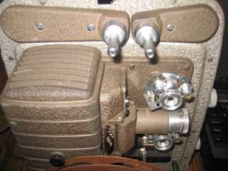 Up for auction is a Vintage Bell & Howell 8mm Projector.