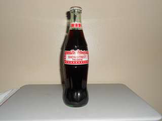 COCA COLA 12oz FULL BOTTLE DOLLYWOOD SHOWSTREET PREMIERE 1992  