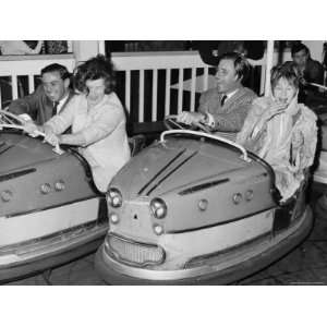  Racing Drivers Graham Hill and Jim Clark Enjoying a Dodgem 