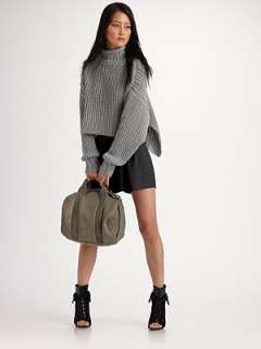 Mock turtleneck Ribbed cuffs Side slits Elongated back About 21 from 