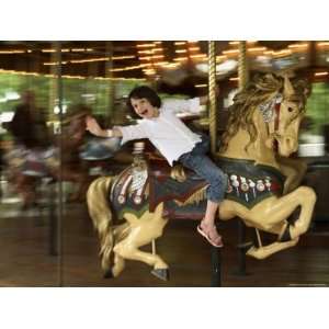  A 6 year old Girl Rides a Horse on a Vintage Carosel 