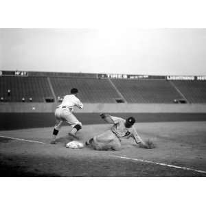 Ty Cobb, major league baseball player, safe at third base after 